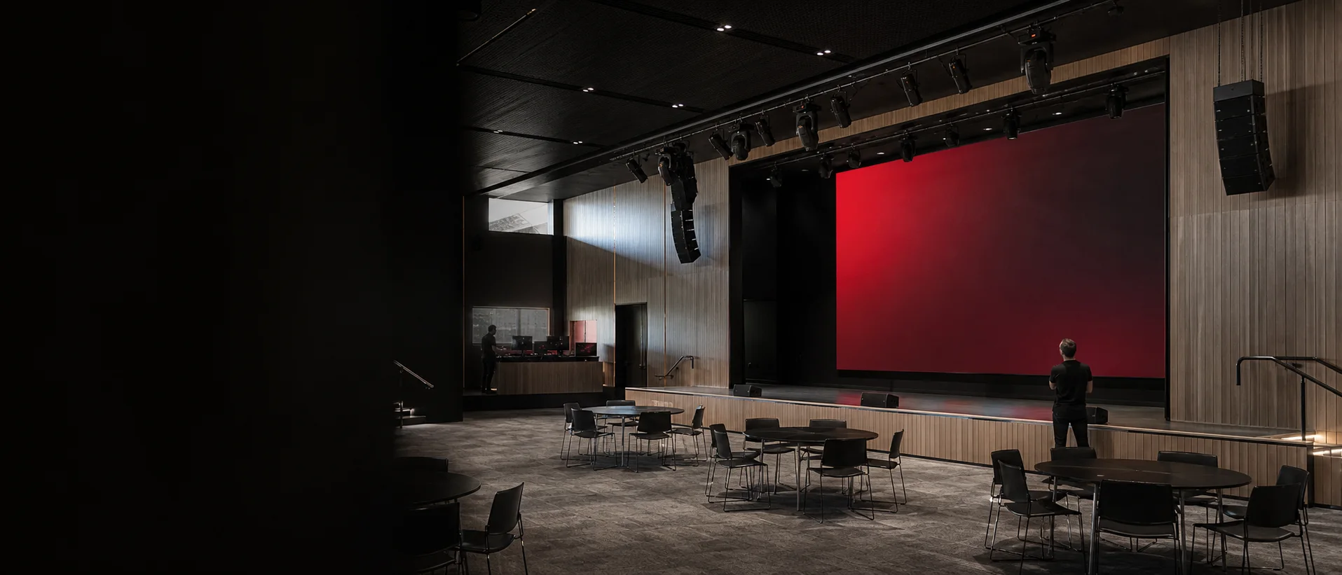 Commercial AV installation in a dark presentation venue